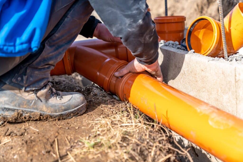 Installation,Of,A,Sewage,Plastic,Pipe,During,The,Construction,Of